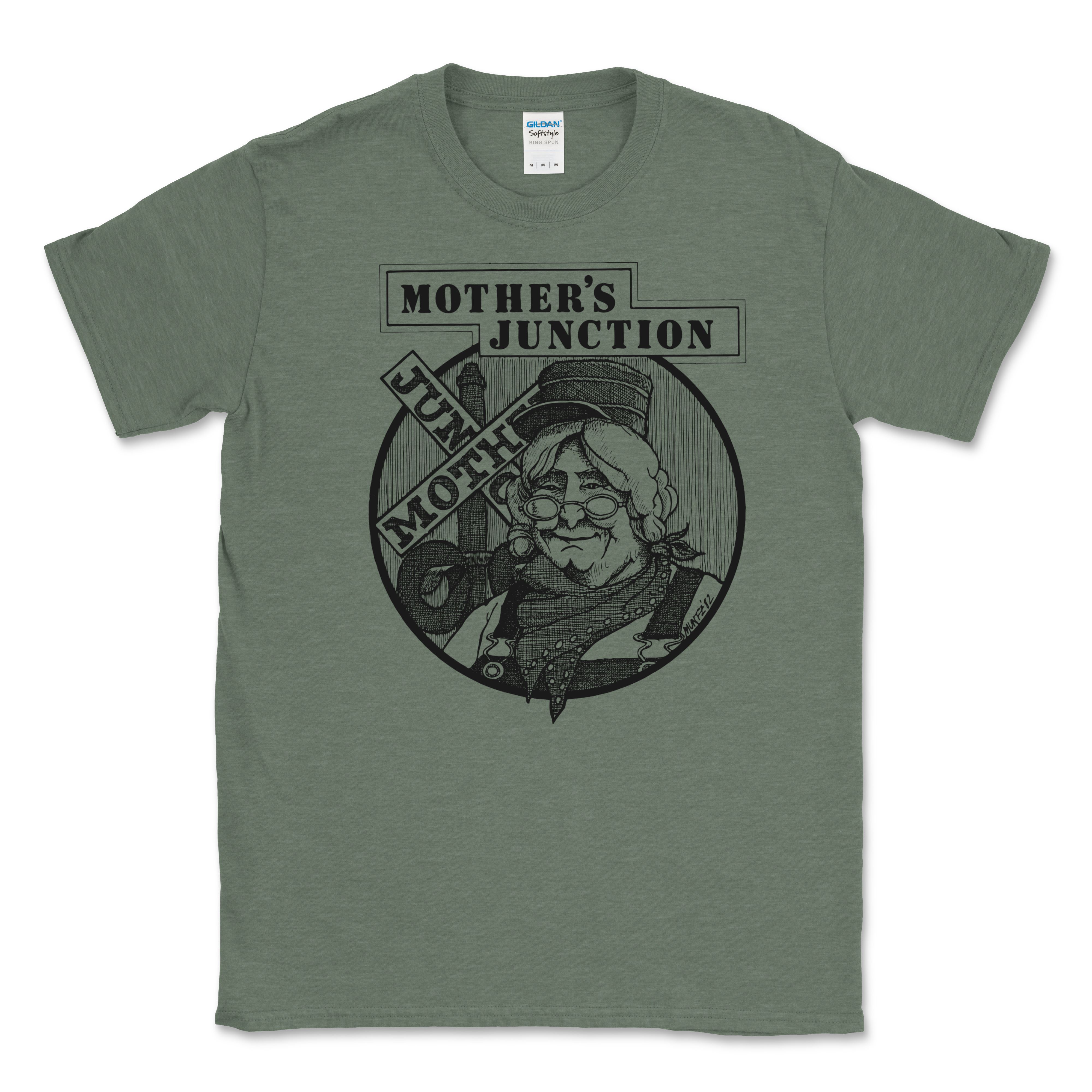Mother's Junction green t-shirt featuring a vintage-style illustration of a woman wearing glasses and a hat, with bold text reading "Mother's Junction" and "Jump Moth.